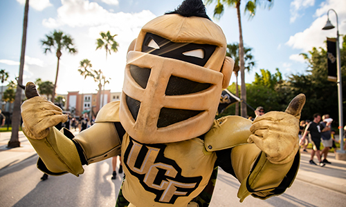 UCF's mascot Knightro giving two thumbs up